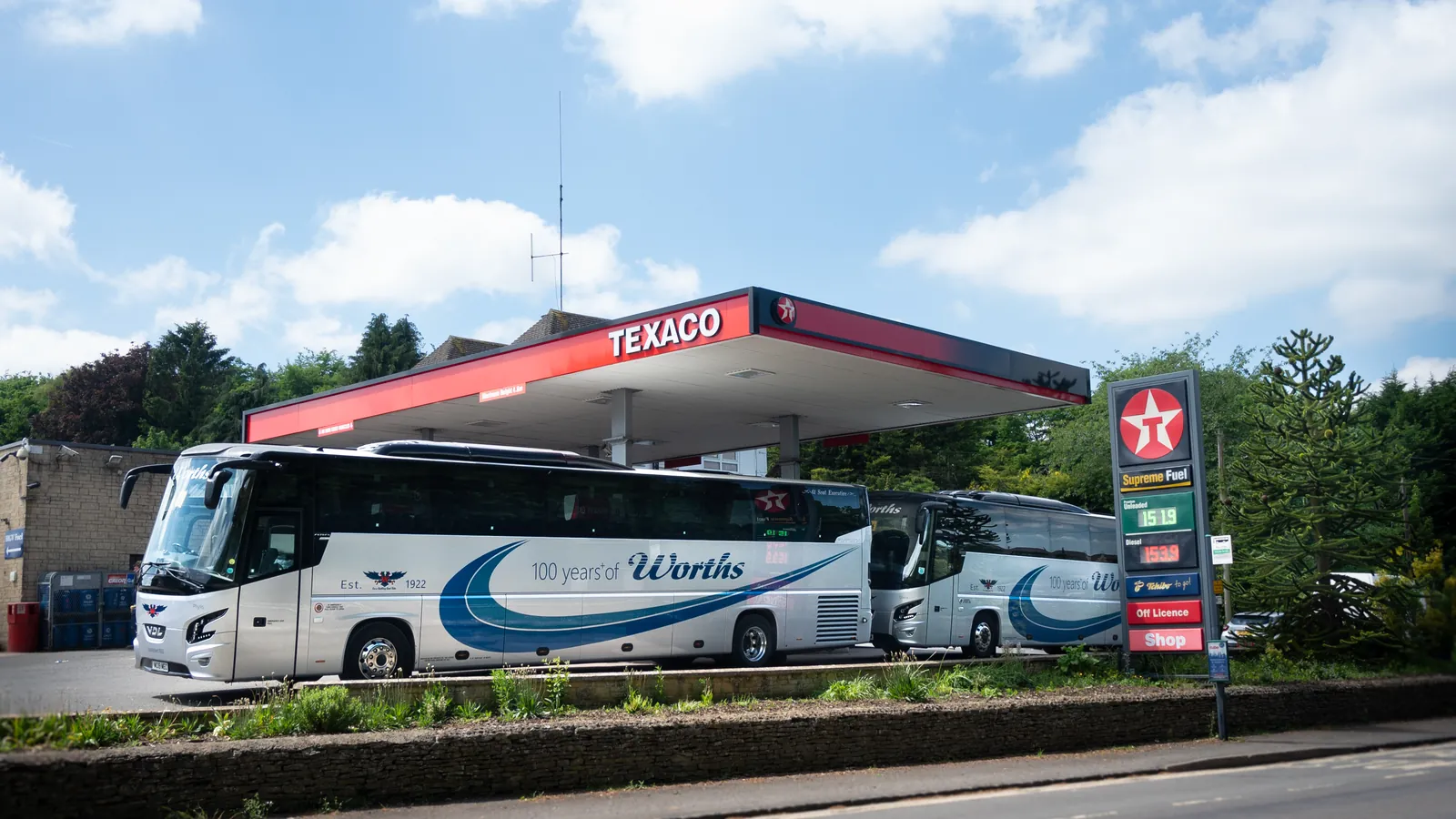 Two Worth's Coaches vehicles on the forecourt at Worth's garage in Enstone, Oxfordshire